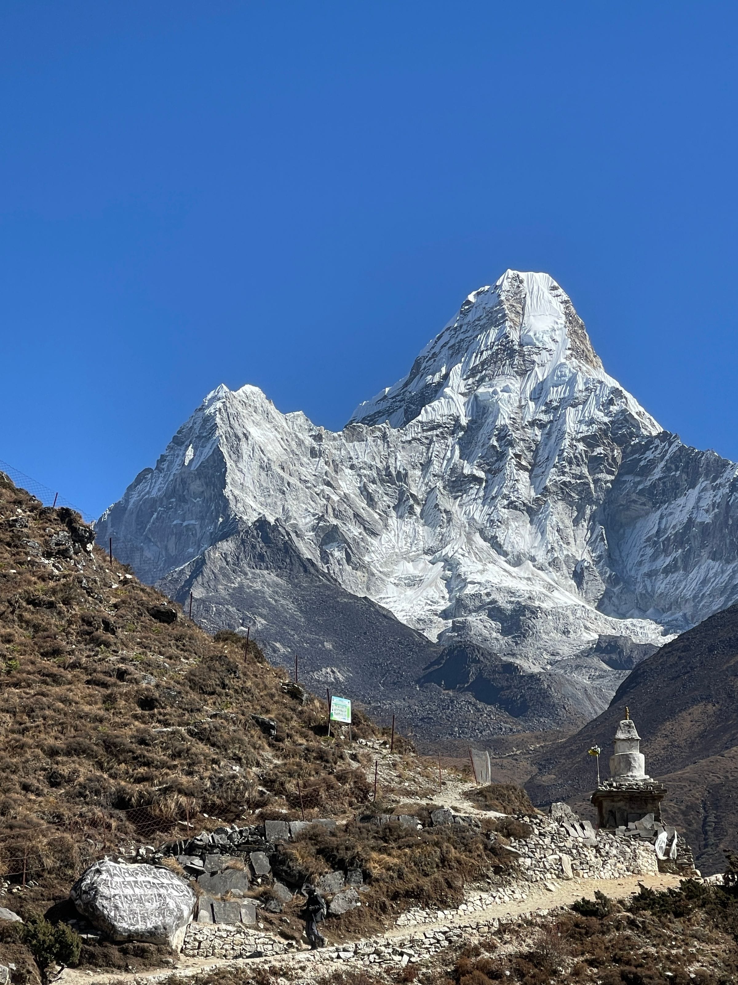 The summit of Ama Dablam rising above the Everest trail