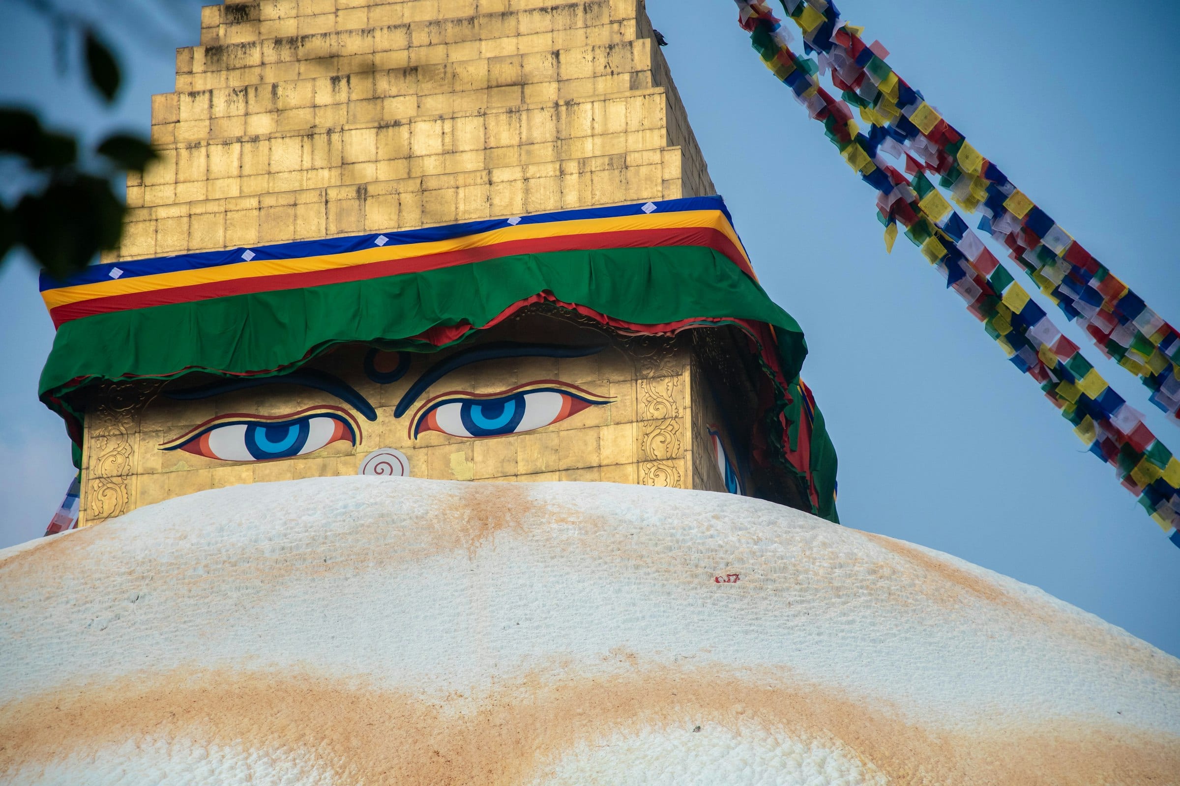 The painted eyes of the Buddha on the gilded cube of Boudhanath stupa