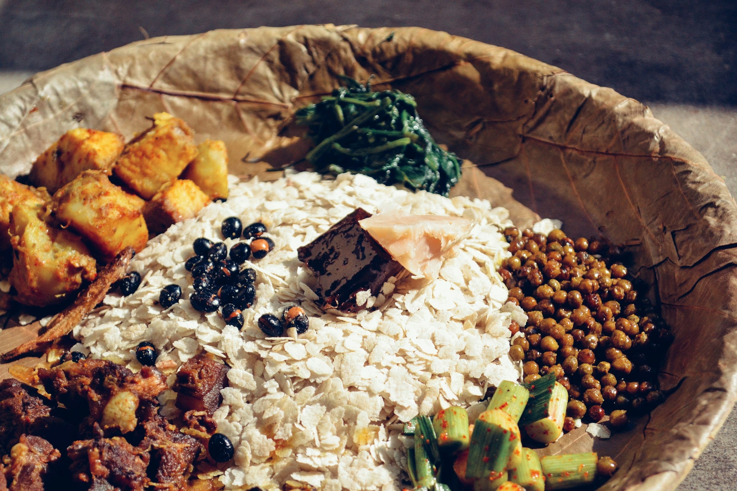 A samay baji platter of beaten rice, soya beans and spiced meat
