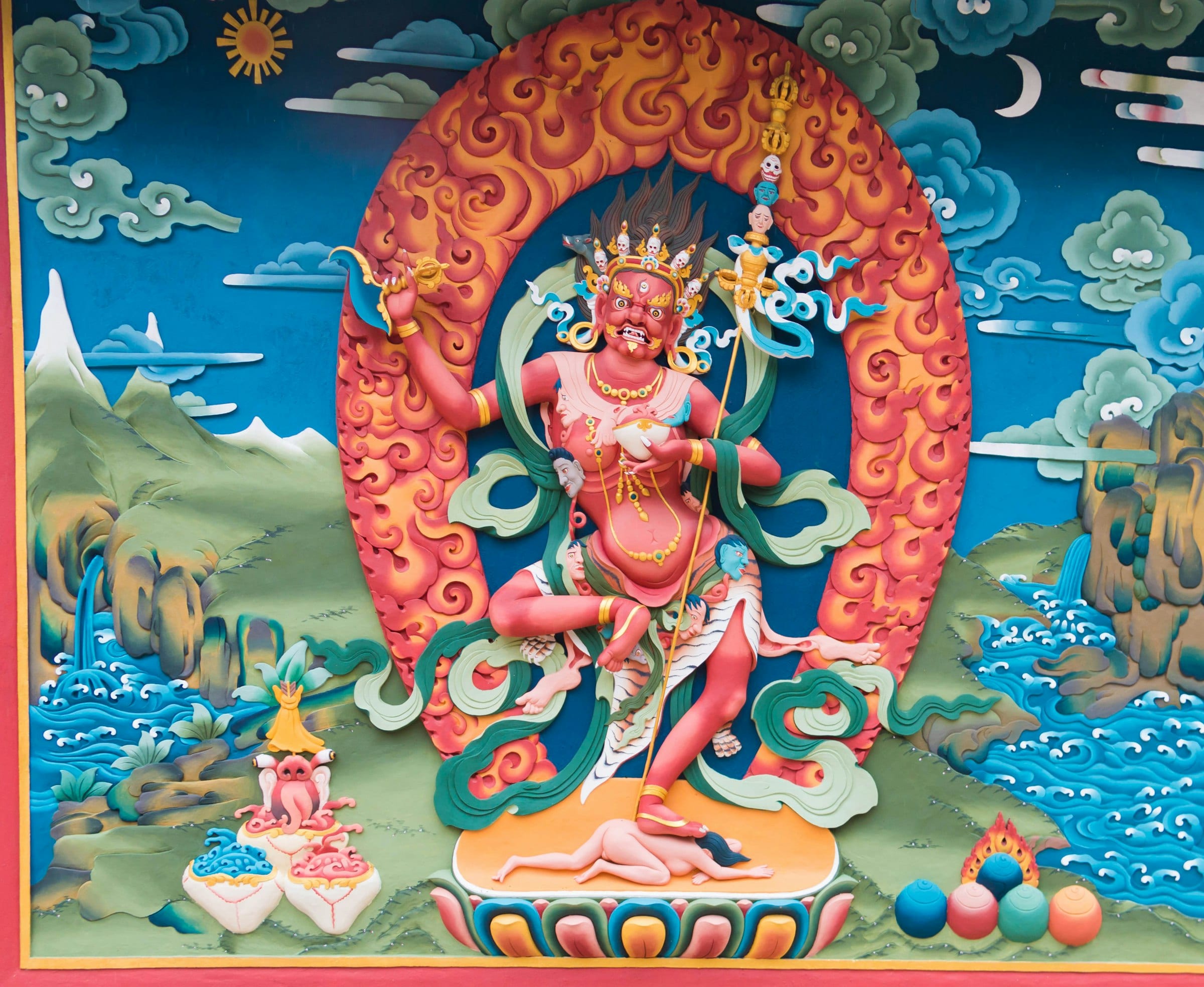 A brightly painted thangka of a Buddhist deity