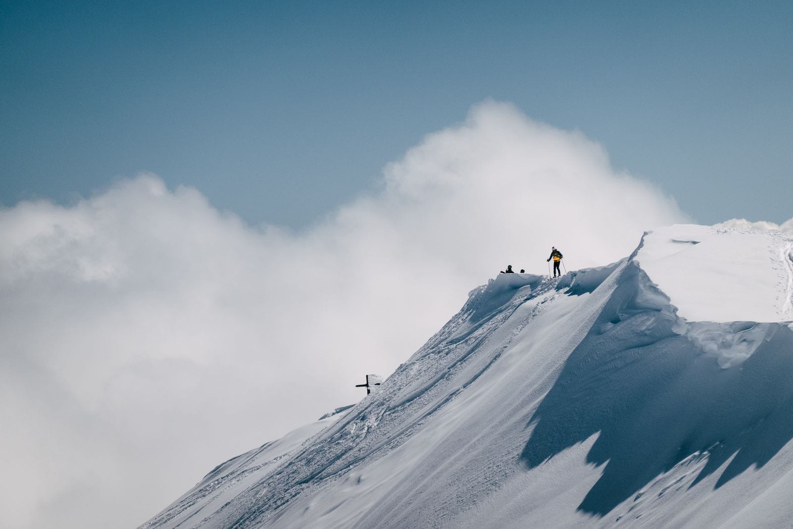 Mountaineer standing on a snowy summit
