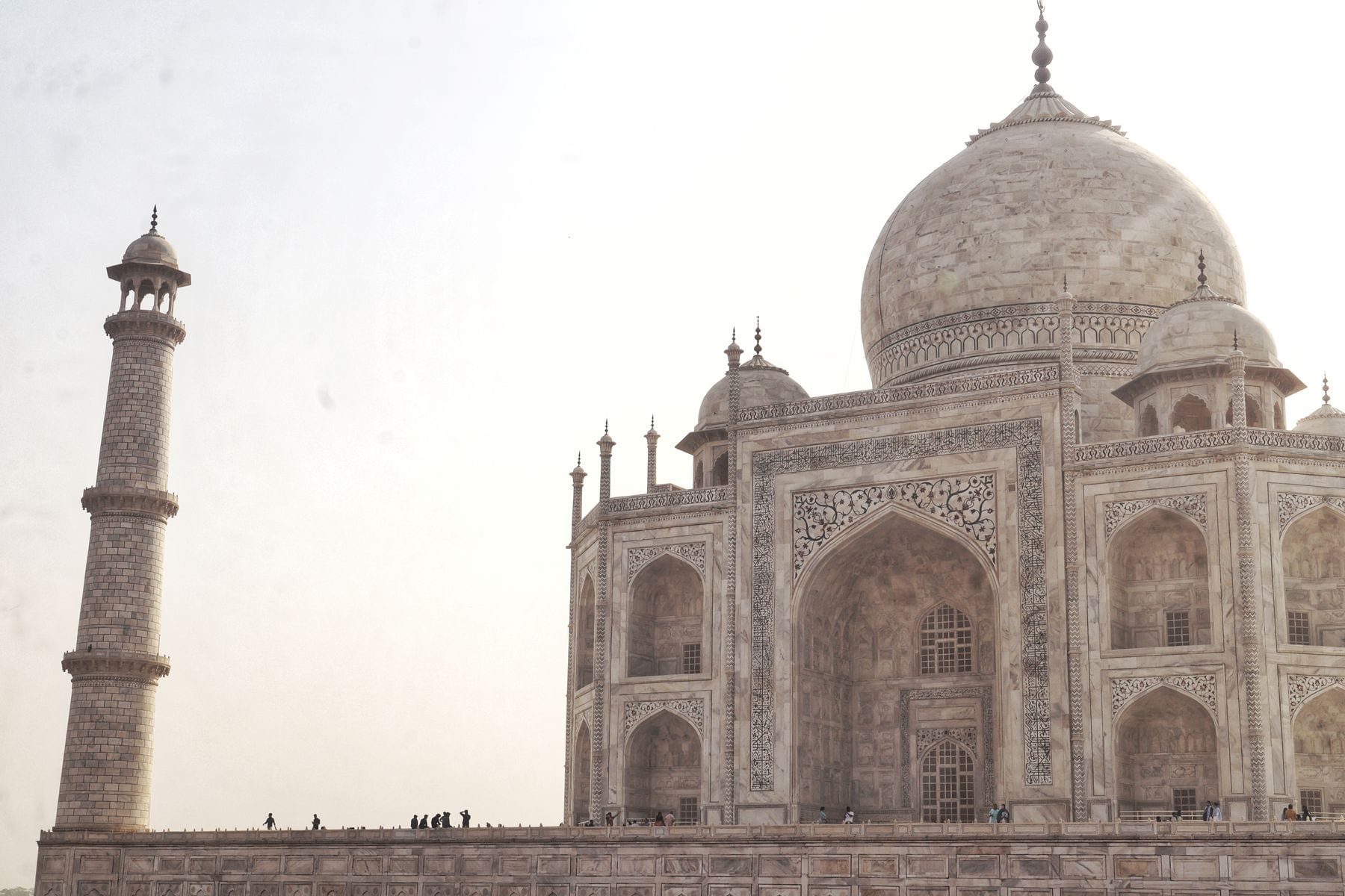 The Taj Mahal in Agra reflected under a clear sky
