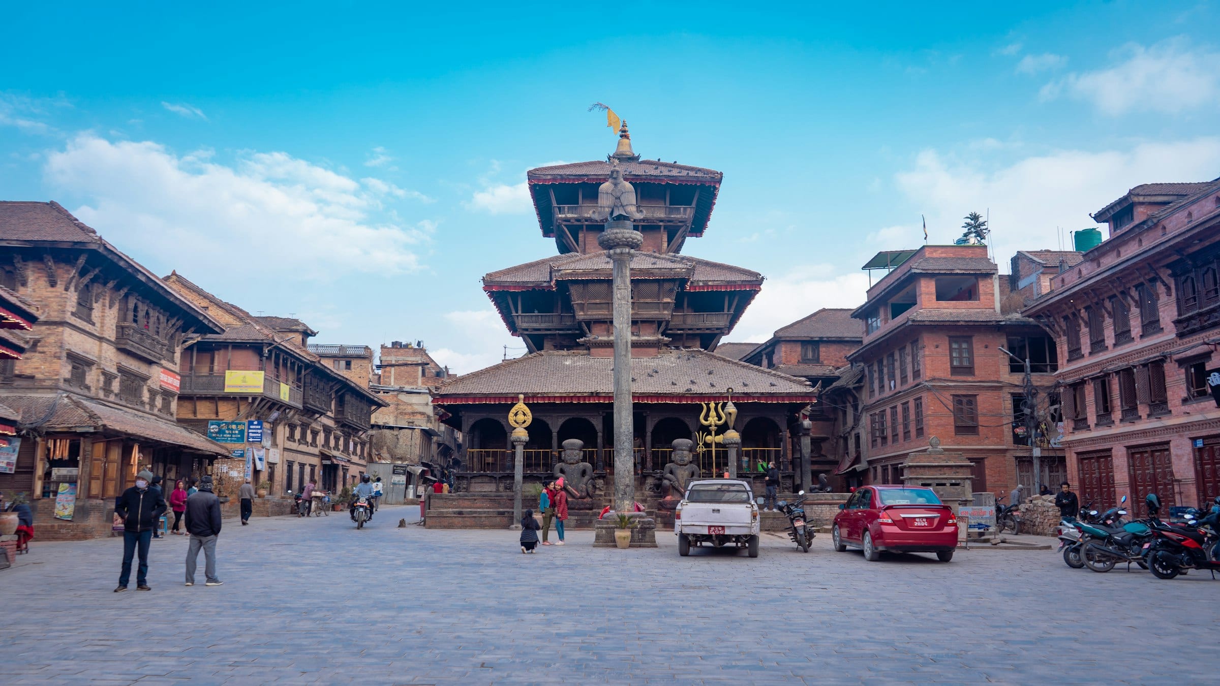 Temples and tiered roofs across the wide brick square at Bhaktapur
